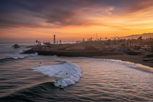 Born in a small, Southern California, blue-collar beach town, graced with world class point breaks and seaside racetracks, where ghosts of a once towering oil industry still linger.